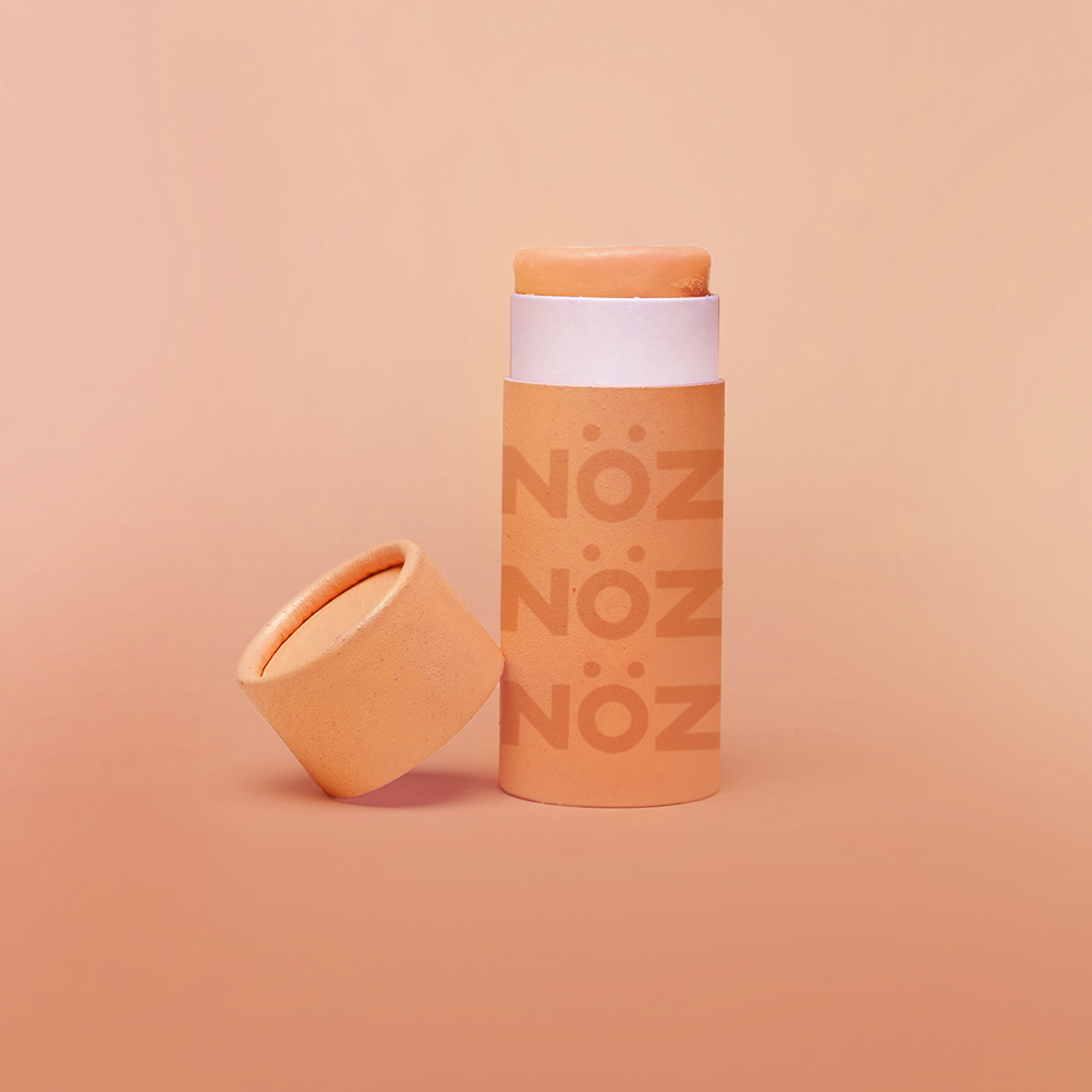 Front view of NÖZ facial sunscreen the the shade orange.