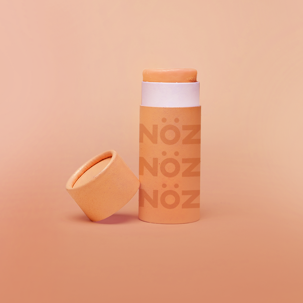 Front view of NÖZ facial sunscreen the the shade orange.