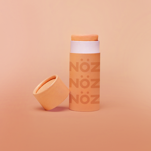 Front view of NÖZ facial sunscreen the the shade orange.